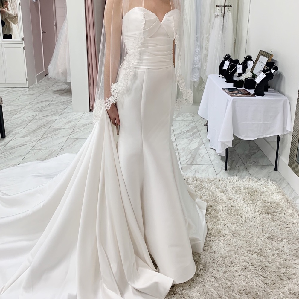 Wedding dress size 4 color is ivory
